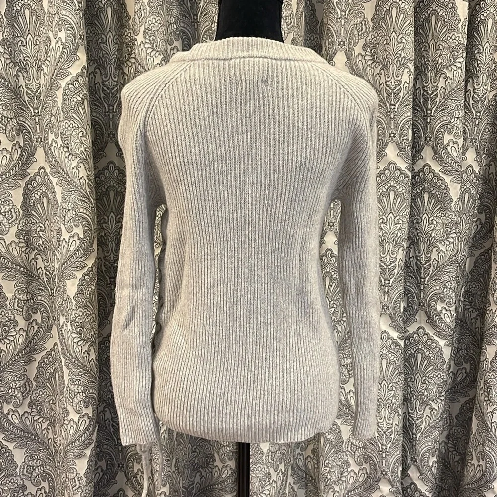 Gray crewneck sweater with lace up detail